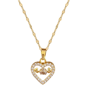 Luxurious gold heart pendant necklace with shimmering crystals on a stainless steel chain