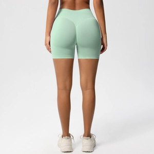 Rear view of mint green high waist seamless fitness shorts with peach lift design