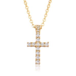 Elegant gold cross necklace with shimmering zircon stones on a white reflective base