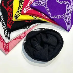 Knitted beanie collection featuring spider web heart jacquard pattern in multiple vibrant colors