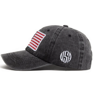Vintage washed black baseball cap featuring USA flag embroidery and side letter patch
