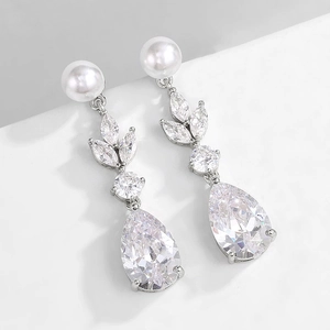 Detail of elegant leaf drop earring with cubic zirconia and a white pearl accent