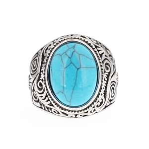 Vintage stainless steel ring with oval turquoise stone and intricate floral engravings