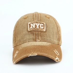 Close-up of vintage washed cotton baseball cap with NYC embroidery and distressed details