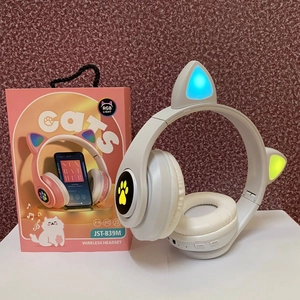 Detail view of JST-B39M white cat ear wireless headset with glowing blue RGB light and box