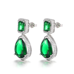 Detail of drop earrings featuring emerald-cut and pear-shaped green cubic zirconia