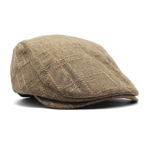 Detail view of brown linen ivy cap showing fine grid texture and structured side profile