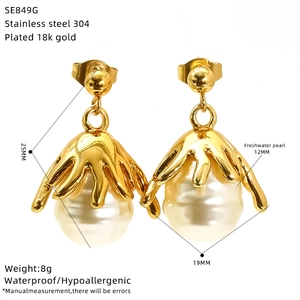Detail view of gold lava style earrings with freshwater pearl and size specifications