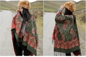 Detailed view of thick ethnic shawl with paisley pattern, tassels and dual-side design