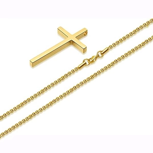 Detailed macro view of the polished golden cross pendant with matching box chain