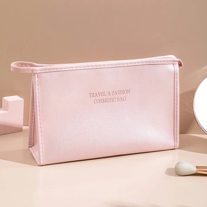 Pink PU leather travel cosmetic bag with handle and Travel & Fashion text print