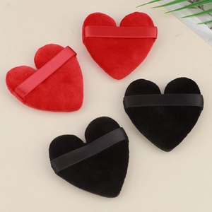 Set of four heart-shaped velvet makeup puffs in red and black with finger ribbons