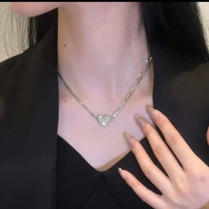 Sparkling diamond heart pendant on a layered silver snake chain for women