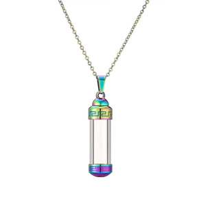 Macro shot of rainbow-colored stainless steel perfume bottle pendant with Greek key pattern