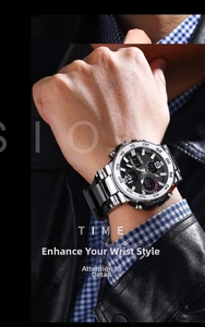 Close-up of a dual-display waterproof sports watch with silver steel band on a wrist