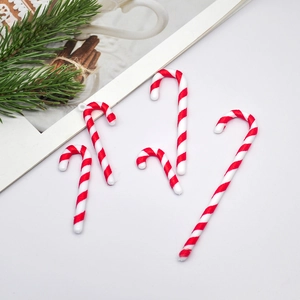 Red and white striped Christmas candy cane ornaments for tree decoration and DIY crafts