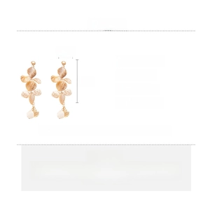 Detail view of gold starfish earrings with shell slices showing dimensions and specifications