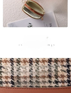 Detailed close-up of stitching and plaid canvas texture on a double-zippered coin purse