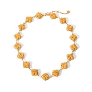 Detail of 18K gold stainless steel chain with square woven texture links and lobster clasp