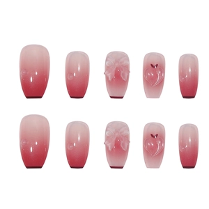 3D bow and heart charm press-on nails with elegant pink to red gradient finish