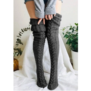 Detail of dark grey cable knit over-knee socks showing texture and long leg warmers fit