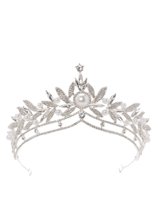 Detailed macro of bridal crown featuring silver metal, faux pearls and clear rhinestones