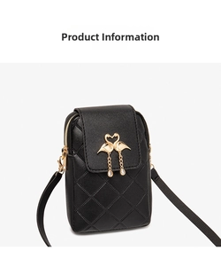 Detail of black quilted phone bag featuring a gold swan metal buckle and chain accent