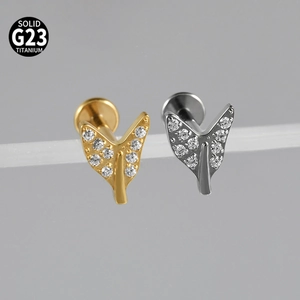Macro shot of V-shaped G23 titanium labret studs with inlaid white zircon stones