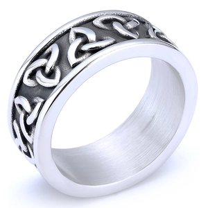 Macro view of Celtic knot engravings and brushed metal interior on a silver steel ring