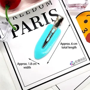 Detail view showing 6cm light blue alligator hair clip dimensions 1.8cm width and 6cm length