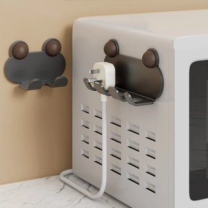 Wall-mounted multi-hook power plug organizer in dark grey for kitchen cable management