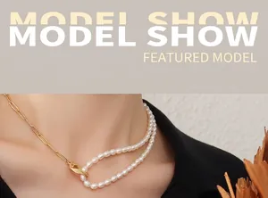 Detail of 18k gold plated paperclip chain and woven pearl necklace on model neck