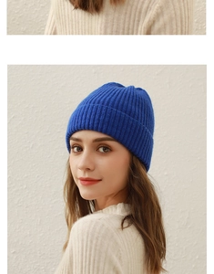 Close-up of the cobalt blue ribbed knit texture on this warm winter beanie for women