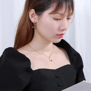 Minimalist gold moon and star jewelry set for women featuring earrings and necklace