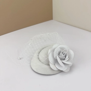 Vintage ivory fascinator hat with handmade rose flower and birdcage veil for weddings