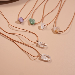 Three-piece set of natural irregular raw crystal necklaces with brown woven ropes