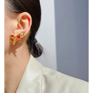 Liquid metal butterfly earrings with gold finish and red zircon accents for women