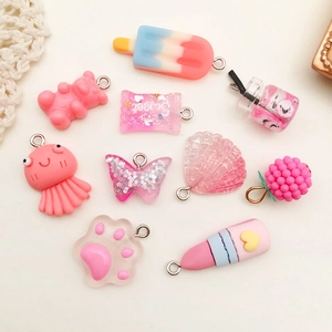 Pink resin pendants assortment including candy and shells for DIY keychain crafts