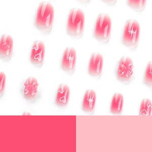 Pink gradient press-on nails with star motifs, heart patterns and 3D bow decorations