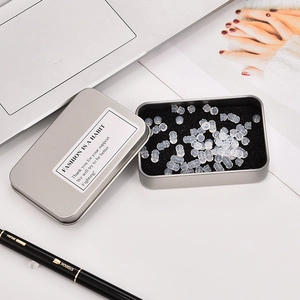 Transparent silicone earring backs in silver tin box with sponge pad and thank you label