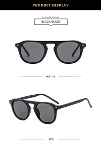 Detail view showing black retro square sunglasses with silver double dot rivets on frame