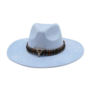 Detail view of light blue wide brim fedora hat with ethnic band and bull head ornament