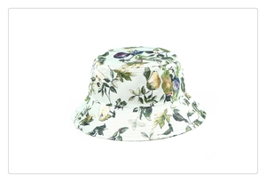 Detailed close-up view of a silk-like bucket hat featuring vintage fruit and floral print