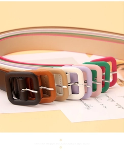 Detail of colorful women's thin belts with matching fabric-wrapped square buckles