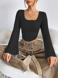Detail of square neck and flared sleeves on a black ribbed knit cropped long sleeve top
