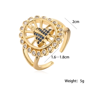 Macro detail of gold plated Virgin Mary ring with blue zircons showing size and 5g weight