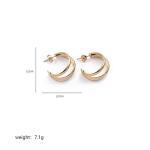 Detailed view of gold multi-layer twisted hoop earrings with 2.2cm diameter and 7.1g weight