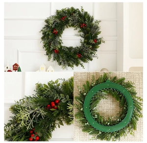 Detail of Christmas wreath featuring red berries, artificial pine needles and back hook