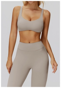 Front view of taupe yoga set featuring a U-neck sports bra and high-waisted leggings