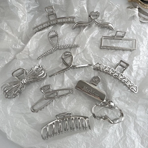Minimalist silver metal hair claws set with geometric shapes and fashion engraving